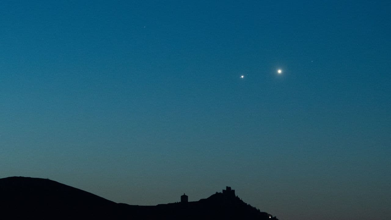 The moon shines with a swarm of stars on May 21 as Jupiter, Venus and Mercury line-up nearby