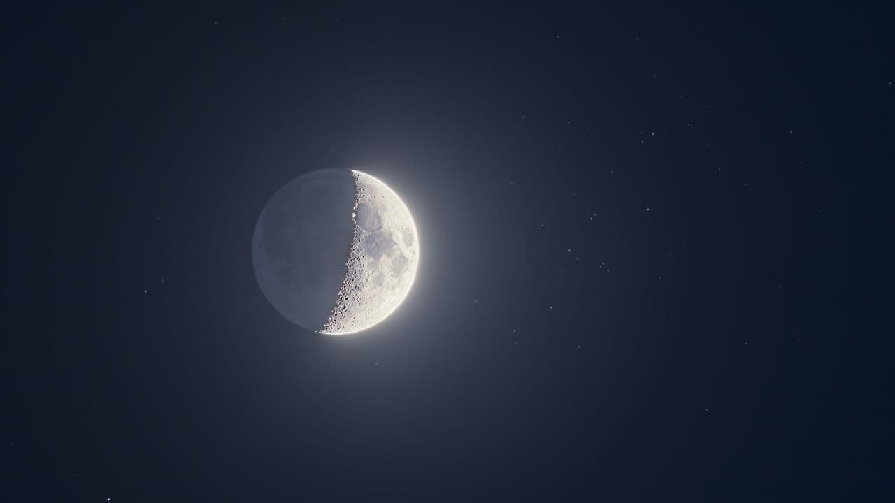 The moon shines with a swarm of stars on May 21 as Jupiter, Venus and Mercury line-up nearby