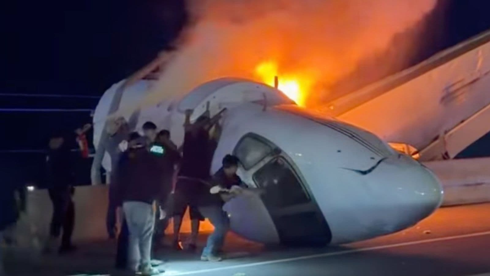 Texas plane crash: One dead after business jet crashes onto highway in Laredo Video